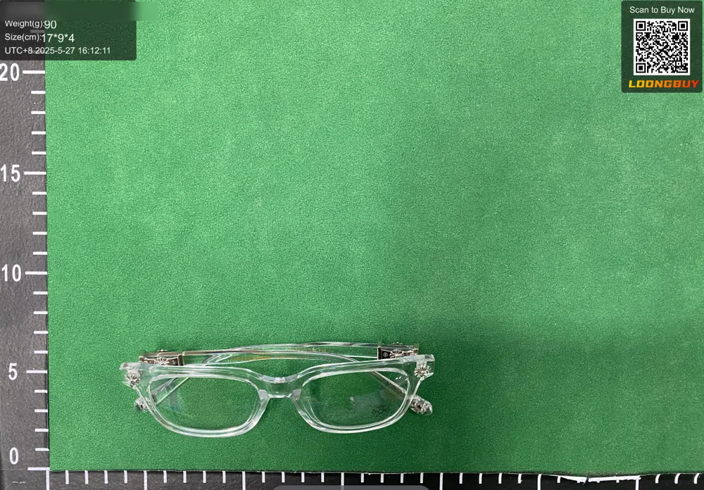 Clear-framed glasses beside a ruler on the inspection bench